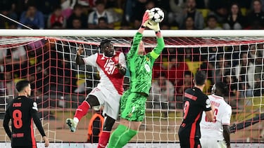 Barcelona's German goalkeeper #01 Marc-Andre Ter Stegen (R) makes a save during the UEFA Champions League 1st round day 1 football match between AS Monaco and FC Barcelona at the Louis II Stadium in the Principality of Monaco on September 19, 2024. (Photo by Miguel MEDINA / AFP)