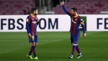 BARCELONA, SPAIN - JANUARY 31: Lionel Messi of Barcelona celebrates after scoring their side&#039;s first goal as team mate Jordi Alba looks on during the La Liga Santander match between FC Barcelona and Athletic Club at Camp Nou on January 31, 2021 in Ba