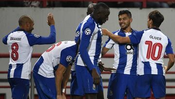 Porto's Mexican forward Jesus Corona (2R) celebrates with teammates after scoring a goal during the UEFA Champions League group D football match between FC Lokomotiv Moscow and FC Porto in Moscow on October 24, 2018. (Photo by Alexander NEMENOV / AFP