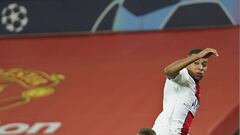 PSG&#039;s Kylian Mbappe, top, tries a shot on goal during a Group H Champions League soccer match between Manchester United and Paris Saint Germain at the Old Trafford stadium in Manchester, England, Wednesday, Dec. 2, 2020. (AP Photo/Dave Thompson)