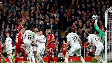 Soccer Football - UEFA Champions League - Liverpool v Real Madrid - Anfield, Liverpool, Britain - November 4, 2025 Liverpool's Virgil van Dijk heads at goal as Real Madrid's Thibaut Courtois makes a save Action Images via Reuters/Jason Cairnduff
