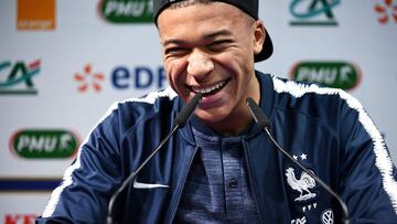 France's national football team forward Kylian Mbappe smiles during a press conference at the team base camp in Clairefontaine en Yvelines on November 18, 2018, two days ahaed of a friendly football match against Uruguay. (Photo by FRANCK FIFE / AFP)