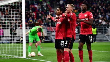 16 March 2023, Hungary, Budapest: Soccer: Europa League, Ferencváros - Bayer Leverkusen, knockout round, round of 16, second leg at Puskás Aréna, Leverkusen's goal scorer Amine Adli (l-r) celebrates with Mitchel Bakker and Edmond Tapsoba after his goal to make it 0:2. Photo: Marton Monus/dpa (Photo by Marton Monus/picture alliance via Getty Images)