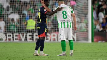 Real Betis' French midfielder #08 Nabil Fekir greets Girona's Dutch midfielder #27 Gabriel Misehouy at the end of the Spanish league football match between Real Betis and Girona FC at the Benito Villamarin stadium in Seville on August 15, 2024. The match ended in a draw 1-1. (Photo by CRISTINA QUICLER / AFP)