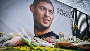 A picture shows flowers put in front of the entrance of the training center La Joneliere in La Chapelle-sur-Erdre on January 25, 2019, four days after the plane of Argentinian forward Emiliano Sala vanished during a flight from Nantes, western France, to