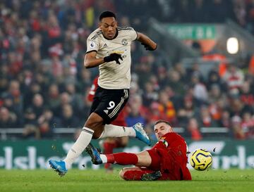 United's Anthony Martial skips through a challenge from Jordan Henderson.