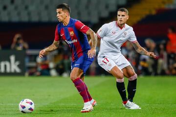 Joao Cancelo y Lamela en un lance del juego.