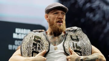 Mixed martial arts star Conor McGregor poses for cameras following a press conference in Las Vegas, Nevada.