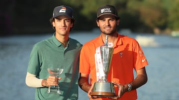 NEW DELHI, INDIA - MARCH 30: Eugenio Chacarra of Spain (R) and his caddie (L) poses with the trophy following victory on day four of the Hero Indian Open 2025 at DLF Golf and County Club on March 30, 2025 in New Delhi, India. (Photo by Luke Walker/Getty Images)
