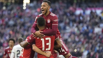 Bayern's Eric Maxim Choupo-Moting, front, celebrates with Bayern's Corentin Tolisso after scoring his side's third goal during the German Bundesliga soccer match between Bayern Munich and TSG 1899 Hoffenheim at the Allianz Arena stadium in