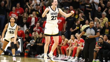 IOWA CITY, IOWA- MARCH 3: Guard Caitlin Clark #22 of the Iowa Hawkeyes celebrates after breaking Pete Maravich's all-time NCAA scoring record during the first half against the Ohio State Buckeyes at Carver-Hawkeye Arena on March 3, 2024 in Iowa City, Iowa.   Matthew Holst/Getty Images/AFP (Photo by Matthew Holst / GETTY IMAGES NORTH AMERICA / Getty Images via AFP)