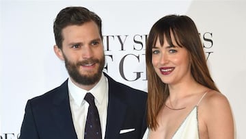 Jamie Dornan y Dakota Johnson en un evento de 'Cincuenta sombras de Grey'.