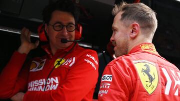 Ferrari&#039;s German driver Sebastian Vettel (R) chats with Ferrari team principal Mattia Binotto after the second practice session for the Formula One Chinese Grand Prix in Shanghai on April 12, 2019. (Photo by GREG BAKER / AFP)
