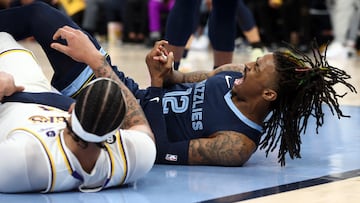 Apr 16, 2023; Memphis, Tennessee, USA; Memphis Grizzlies guard Ja Morant (12)reacts after falling to the ground during the second half during game one of the 2023 NBA playoffs against the Los Angeles Lakers at FedExForum. Mandatory Credit: Petre Thomas-USA TODAY Sports