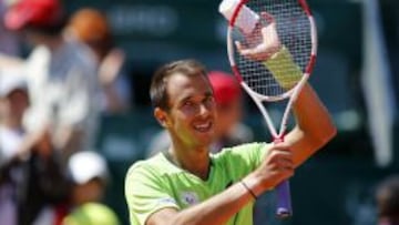 Lukas Rosol of Czech Republic celebrates his win over Robin Haase. REUTERS/Bogdan Cristel (ROMANIA  - Tags: SPORT TENNIS)