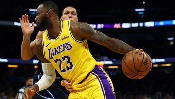 Dec 11, 2019; Orlando, FL, USA; Los Angeles Lakers forward LeBron James (23) drives to the basket as Orlando Magic forward Aaron Gordon (00) defends during the first quarter at Amway Center. Mandatory Credit: Kim Klement-USA TODAY Sports