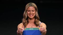 Former New Zealand player Maia Jackman displays the country Spain during the football draw ceremony for the Australia and New Zealand 2023 FIFA Women's World Cup at the Aotea Centre in Auckland on October 22, 2022. (Photo by WILLIAM WEST / AFP) (Photo by WILLIAM WEST/AFP via Getty Images)