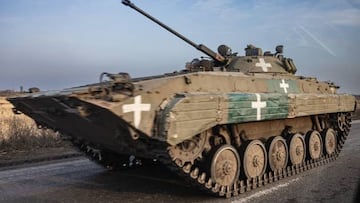 A Ukrainian soldier drives a personnel armoured carrier on a road in Donetsk region on December 25, 2022, amid the Russian invasion of Ukraine. (Photo by Sameer Al-DOUMY / AFP) (Photo by SAMEER AL-DOUMY/AFP via Getty Images)