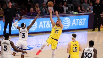 Apr 22, 2025; Los Angeles, California, USA; Los Angeles Lakers guard Luka Doncic (77) shoots the ball over Minnesota Timberwolves forward Jaden McDaniels (3) during the third quarter of game two of first round for the 2024 NBA Playoffs at Crypto.com Arena. Mandatory Credit: Kiyoshi Mio-Imagn Images