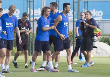 Antoine Griezmann y Sergio Busquets 
