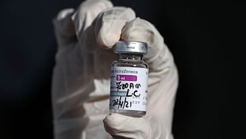 A nurse shows a vial of the AstraZeneca vaccine against COVID-19 at an express drive through vaccination center at the Romel Fernadez Stadium in Panama City, on April 22, 2021. - Panama starts the vaccination process of Astrazeneca to volunteers in an att