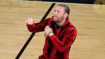 (FILES) Conor McGregor is seen on the court during a timeout in Game Four of the 2023 NBA Finals between the Denver Nuggets and the Miami Heat at Kaseya Center on June 09, 2023 in Miami, Florida. Irish mixed martial arts superstar Conor McGregor has been accused of sexually assaulting a woman at an NBA Finals in Miami last week, multiple US reports said June 15, 2023. (Photo by Megan Briggs / GETTY IMAGES NORTH AMERICA / AFP)