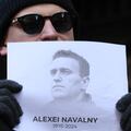 People attend a vigil after the death of Alexei Navalny, outside the Russian consulate in New York
