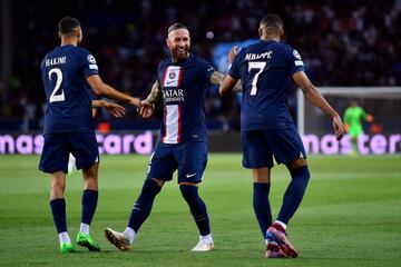 Kylian Mbappe of Paris Saint-Germain is congratulated by Achraf Hakimi and Sergio Ramos