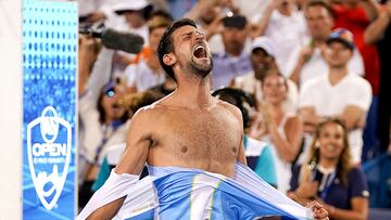 Aug 20, 2023; Mason, OH, USA; Novak Djokovic, of Serbia, rips his shirt in celebration after defeating Carlos Alcaraz, of Spain, at the conclusion of the men?s singles final of the Western & Southern Open tennis tournament at Lindner Family Tennis Center. Mandatory Credit: Kareem Elgazzar/The Enquirer-USA TODAY Sports     TPX IMAGES OF THE DAY