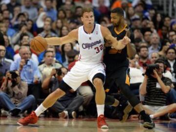 Mar 10, 2014; Los Angeles, CA, USA; Los Angeles Clippers power forward Blake Griffin (32) drives against Phoenix Suns power forward Markieff Morris (11) during the first half at Staples Center. Mandatory Credit: Richard Mackson-USA TODAY Sports