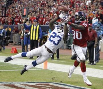 Andre Johnson (80) y Vontae Davis (23).