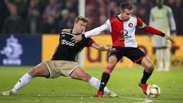 Striker Robin van Persie (R) of Feyenoord Rotterdam duels against defender Matthijs de Ligt of Ajax Amsterdam during the semi finals of the Dutch KNVB Cup football match in Rotterdam on February 27, 2019. (Photo by Olaf KRAAK / ANP / AFP) / Netherlands OU
