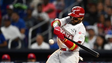 Panama's infielder #14 Johan Camargo takes a swing during the Caribbean Series baseball game between the Dominican Republic and Panama at LoanDepot Park in Miami, Florida, on February 7, 2024. (Photo by Chandan Khanna / AFP)