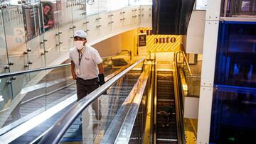 Customers use the escalators -marked to keep physical distance- at a shopping mall in Lima on June 22, 2020, amid the COVID-19 coronavirus pandemic. - Peru began the reopening of the shopping malls on Monday, when the country celebrates 99 days of confinement and the confirmed cases of COVID-19 almost reach 255,000, in an attempt to accelerate the reactivation of the economy, which fell 40% year-on-year in April. (Photo by Ernesto BENAVIDES / AFP)