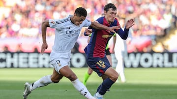 Barcelona's Danish defender #15 Andreas Christensen fights for the ball with Real Madrid's English midfielder #05 Jude Bellingham during the Spanish league football match between FC Barcelona and Real Madrid CF at Estadi Olimpic Lluis Companys in Barcelona, on May 11, 2025. (Photo by LLUIS GENE / AFP)
