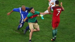Pitch invader at Portugal match tries to hug Cristiano Ronaldo
