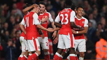 LONDON, ENGLAND - APRIL 05: Mesut Ozil of Arsenal celebrates scoring his sides first goal with his Arsenal team mates during the Premier League match between Arsenal and West Ham United at the Emirates Stadium on April 5, 2017 in London, England.  (Photo 