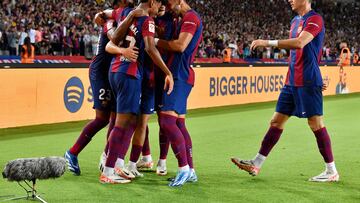 Barcelona's Spanish forward #27 Lamine Yamal (2L) and teammates celebrate Sevilla's Spanish defender #04 Sergio Ramos' owngoal during the Spanish Liga football match between FC Barcelona and Sevilla FC at the Estadi Olimpic Lluis Companys in Barcelona on September 29, 2023. (Photo by Pau BARRENA / AFP)