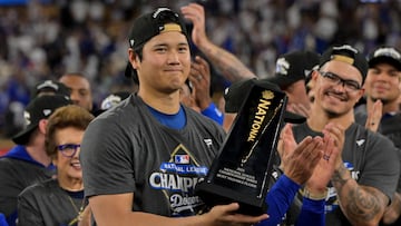 Oct 18, 2025; Los Angeles, California, USA; Los Angeles Dodgers two-way player Shohei Ohtani (17) holds the MVP trophy after defeating the Milwaukee Brewers in game five of the NLCS during the 2025 MLB playoffs at Dodger Stadium. Mandatory Credit: Jayne Kamin-Oncea-Imagn Images