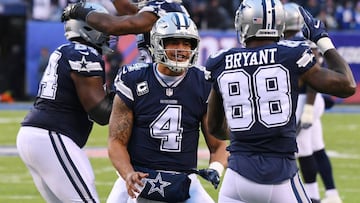 (EDITORS NOTE: caption correction) Dec 10, 2017; East Rutherford, NJ, USA; Dallas Cowboys quarterback Dak Prescott (4) and wide receiver Dez Bryant (88) celebrate a touchdown by running back Rod Smith (with ball) in the fourth quarter against the New York Giants during a NFL football game at MetLife Stadium. Mandatory Credit: Robert Deutsch-USA TODAY Sports