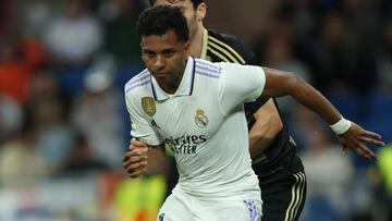 Real Madrid's Brazilian forward Rodrygo (R) controls the ball during the Spanish league football match between Real Madrid CF and RC Celta de Vigo at the Santiago Bernabeu stadium in Madrid on April 22, 2023. (Photo by Thomas COEX / AFP)