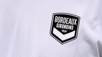 (FILES) This file photo taken on July 2, 2020 shows Girondins de Bordeaux new club logo on a player's jersey during the first training session of the football team in Le Haillan, near Bordeaux, southwestern France, following the interruption of the F