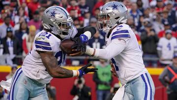 Nov 21, 2021; Kansas City, Missouri, USA; Dallas Cowboys quarterback Dak Prescott (4) hands off to running back Ezekiel Elliott (21) against the Kansas City Chiefs during the first half at GEHA Field at Arrowhead Stadium. Mandatory Credit: Denny Medley-US