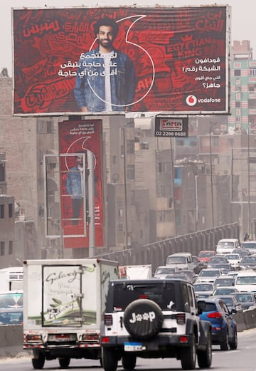 A traffic jam is seen next to a Vodafone mobile phone advertisement featuring Liverpool's Egyptian forward Mohamed Salah in Cairo, Egypt May 2, 2018. The words on the advertisement read as "Stronger than anything - Number one in Egypt."