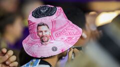 A fan wears a Lionel Messi bucket hat