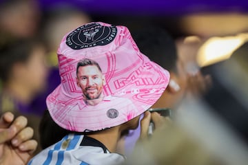 A fan wears a Lionel Messi bucket hat 