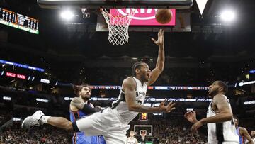 SAN ANTONIO,TX - JANUARY 31: Kawhi Leonard #2 of the San Antonio Spurs scores by Steven Adams #12 of the Oklahoma City Thunder as teammate LaMarcus Aldridge #12 of the San Antonio Spurs watches at AT&amp;T Center on January 31, 2017 in San Antonio, Texas. NOTE TO USER: User expressly acknowledges and agrees that , by downloading and or using this photograph, User is consenting to the terms and conditions of the Getty Images License Agreement.   Ronald Cortes/Getty Images/AFP
 == FOR NEWSPAPERS, INTERNET, TELCOS &amp; TELEVISION USE ONLY ==