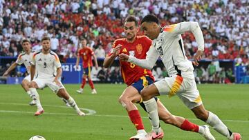 Spain's midfielder #08 Fabian Ruiz fights for the ball with Germany's midfielder #10 Jamal Musiala during the UEFA Euro 2024 quarter-final football match between Spain and Germany at the Stuttgart Arena in Stuttgart on July 5, 2024. (Photo by THOMAS KIENZLE / AFP)