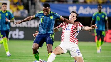 Mar 26, 2026; Orlando, Florida, USA; Colombia midfielder Jhon Arias (11) fights for the ball with Croatia midfielder Martin Pasalic (26) during the second half at Camping World Stadium. Mandatory Credit: Travis Register-Imagn Images