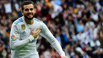 Real Madrid's Spanish defender Nacho Fernandez celebrates after scoring a goal during the Spanish league football match between Real Madrid and Sevilla at the Santiago Bernabeu Stadium in Madrid on December 9, 2017. / AFP PHOTO / PIERRE-PHILIPPE MARCOU